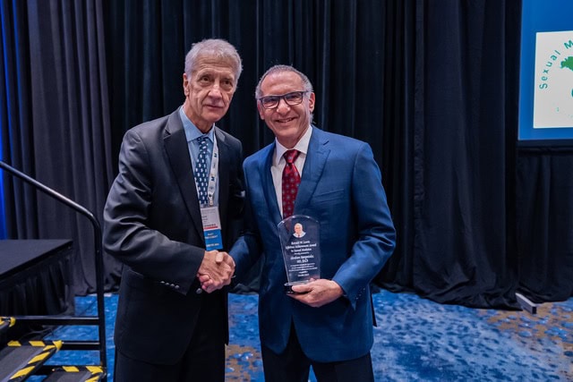 Dr. Abe Morgentaler receiving the SMSNA Lifetime Achievement Award